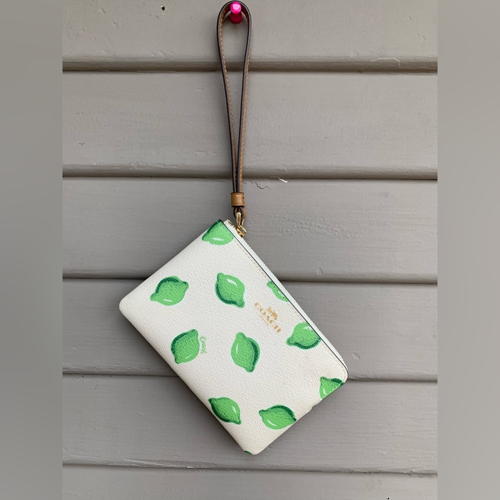 COACH authentic leather lime print small wristlet.